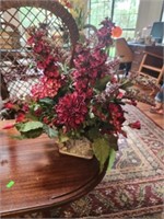 Faux floral arrangement in planters pot