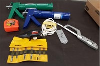 Flat- 2 Caulk Guns, Measure Tape, Jigsaw Blades