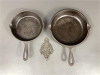 Two Cast Iron Skillets & Wall Hanger