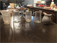 Lot of 5 pitchers - 3 glass, 1 plastic, 1 tin