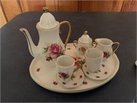 2 miniature tea sets both unmarked, one cup
