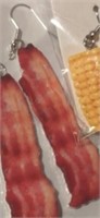 2 pair of earrings, bacon and corn on the cob.