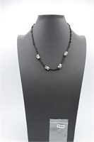 Glass white beads with black polka dots