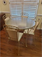 Round metal glass top table and chairs