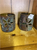 Two signed pottery candleholders