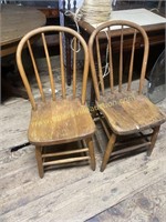 Pair of two primitive side chairs