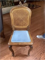 Custom upholstered cane back wooden chair