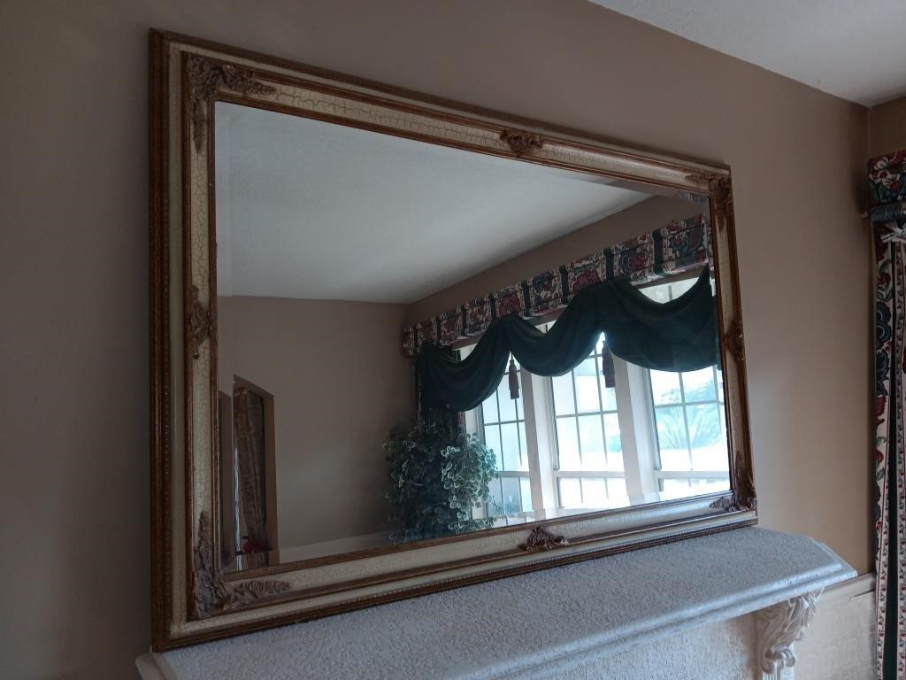 Large beveled mirror 69 inches by 45 inches.