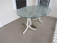 Glass, oval patio table & 6 chairs