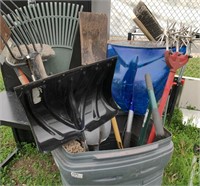 Rubbermaid can containing various yard tools