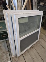 Pair of white metal framed windows