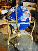 Semi precious stone globe on brass stand