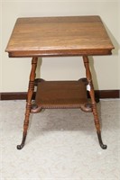 WOODEN FOUR LEGGED TABLE WITH ORNATE FEET