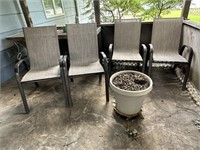 2 patio chairs and flower pot