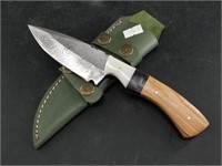 Damascus bladed knife with wood scales and 4 way s