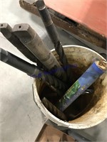 Large drill bits in bucket