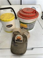 bait buckets and a hat