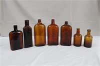 Collection of Amber bottles Barnes, Seagram's,
