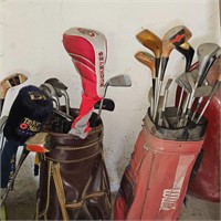LARGE ASSORTMENT OF GOLF CLUBS AND BAGS