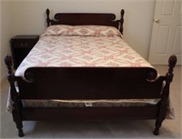 Full size mahogany bed with bedding