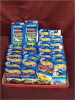 Box With Assortment Of NIB Hot Wheel Singles and 2