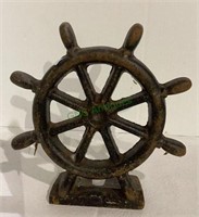 Cast iron ships wheel doorstop measuring 8