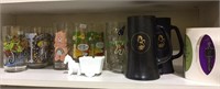 Shelf lot of collector glasses, Playboy mugs,