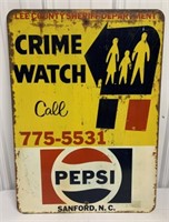 Pepsi adv. on Crime Watch street sign