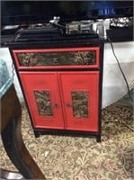 Red and black Asian side cupboard