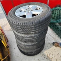 4 - 235/65R16 Tires shot on Nissan 5 bolt rims