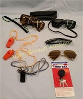 Assorted sunglasses, emergency whistles, key