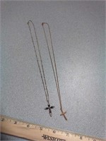 2 cross necklaces. 1 is sterling silver