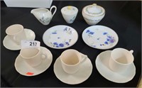 Antique china tea cups, saucers, and tea set