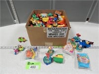 Box full of toys; most appear to be Happy Meal toy