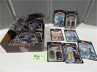 Collectible Star Wars action figurines in original