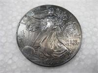 1999 Toned 1 Troy Oz. .999 Silver Eagle Dollar