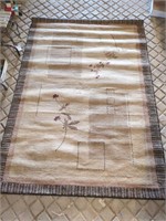 Area rug approx 7.5 ft x  5ft w