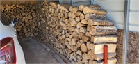 cut dried hardwood firewood under carport