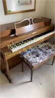 Baldwin Piano and bench, with sheet music