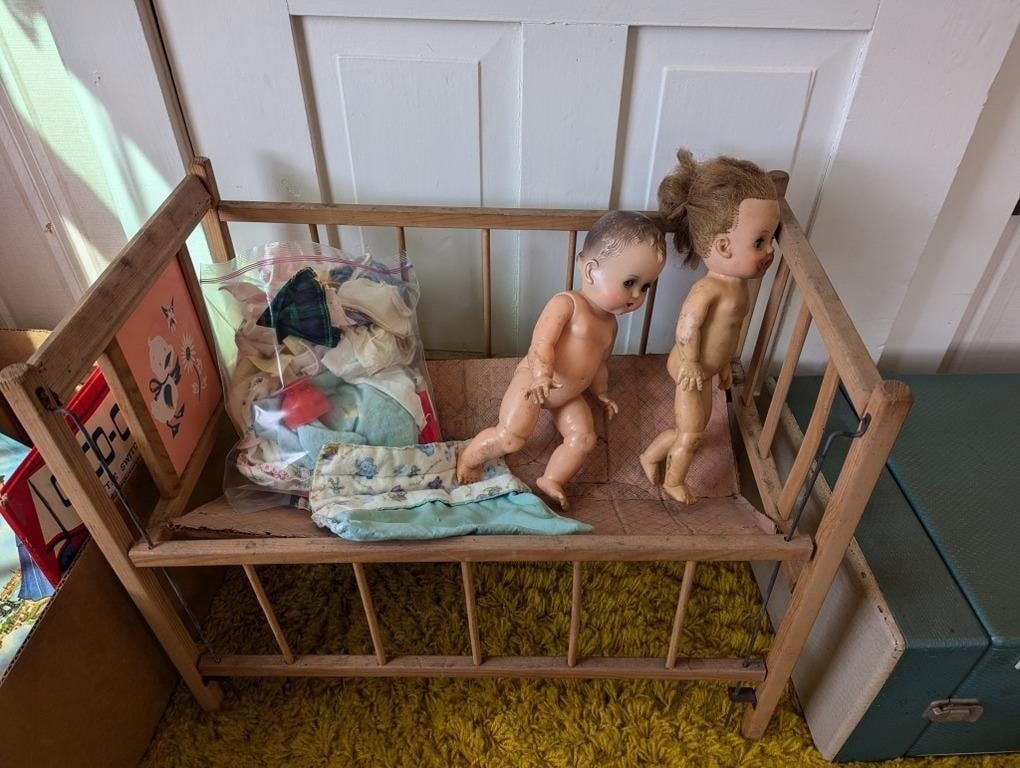 Wooden doll craddle with vintage dolls clothes