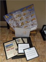 Assortment of picture frames and Aviation posters