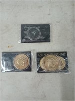 Two commemorative Donald Trump coins, and one