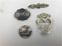 FOUR STERLING BROOCHES
