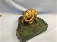 Soapstone carving of a bear holding a fish, with a