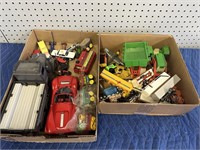 2 BOXES OF TOY TRUCKS AND MORE