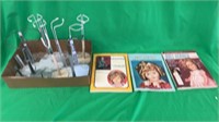 Box of doll stands and books