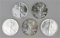 5 1987 One Ounce Fine Silver Eagles.