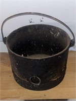 6 inch tall by 10 inch in diameter cast-iron pot