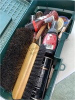 Plastic toolbox filled with shoeshine supplies