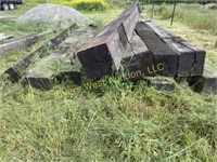 12 pieces of railroad timbers, 10 in.² by 12 feet